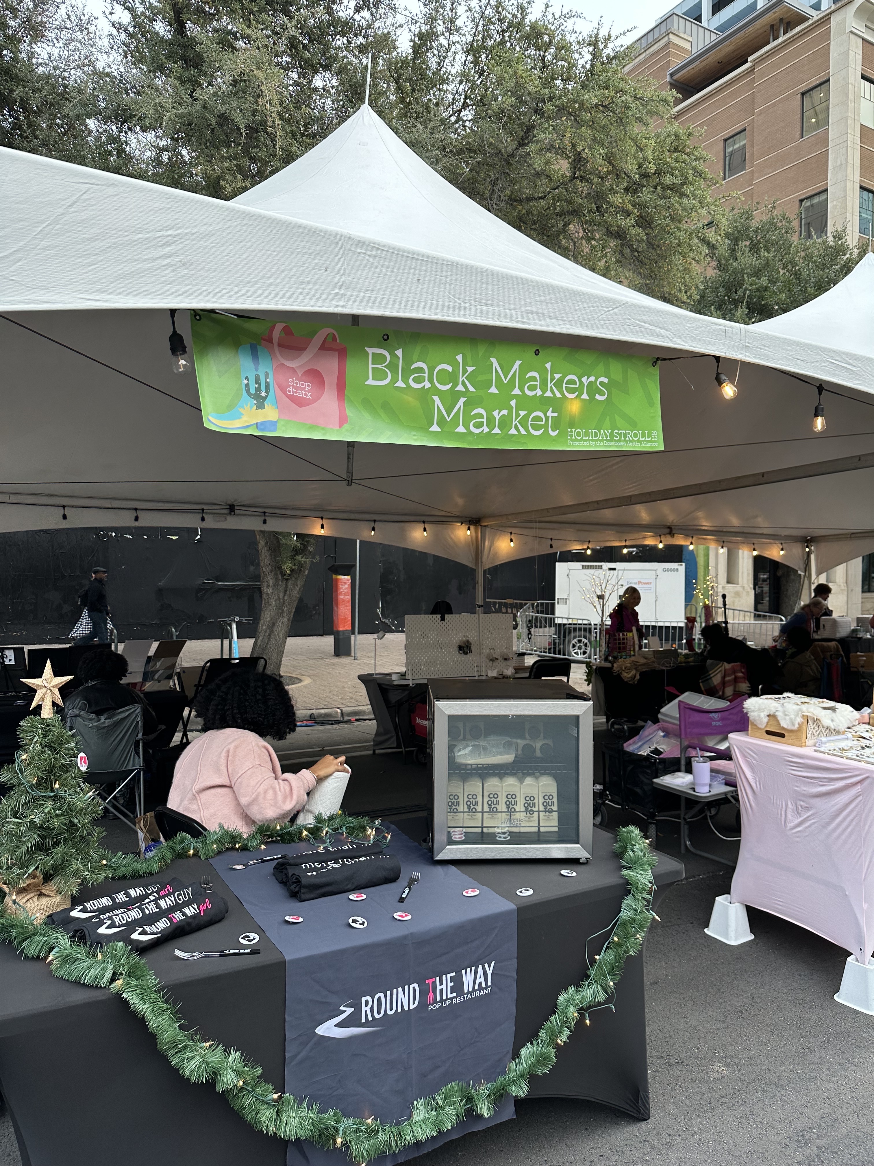 signage for vendors at holiday stroll 2022 designed by ashley rose marino of ashrose creative. each kind of vendor had a different color sign.